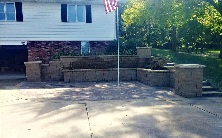 retaining wall brick patio with flag pole