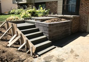 concrete steps and walkway with retaining walls