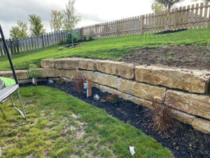 stone retaining wall with landscaping