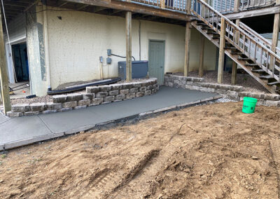 cement walkway and small utility retaining wall