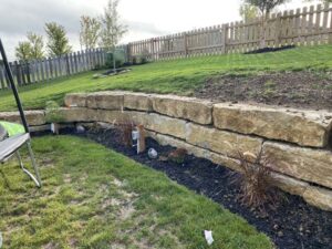 landscaped large rock retaining wall