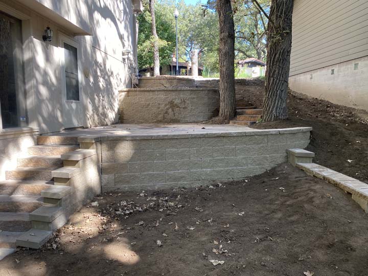 Side yard with steps and retaining wall