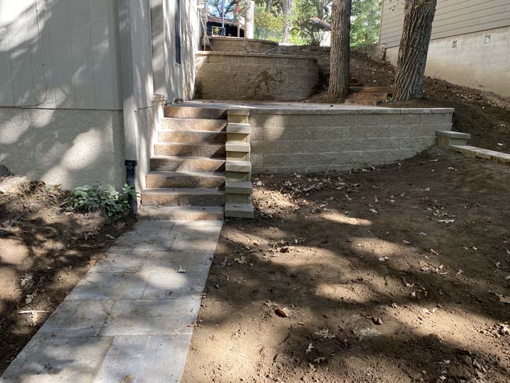 Side yard with steps and retaining wall